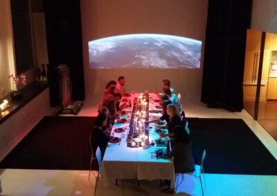 Guests enjoying dinner at elegantly arranged tables.