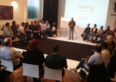 Large conference room with tables and peopl