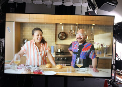 Filming a cooking episode in a modern kitchen studio