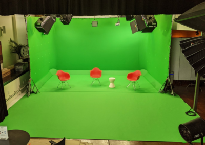 Green screen studio with interactive elements.