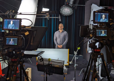 Studio setup with a black limbo backdrop for filming.