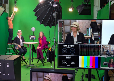 Virtual production setup with greenscreen and real-time rendering at The Producer's Loft Studio.