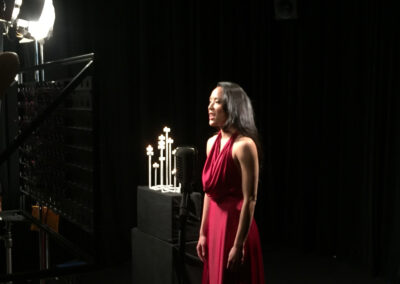 Opera performance in a black limbo studio setting